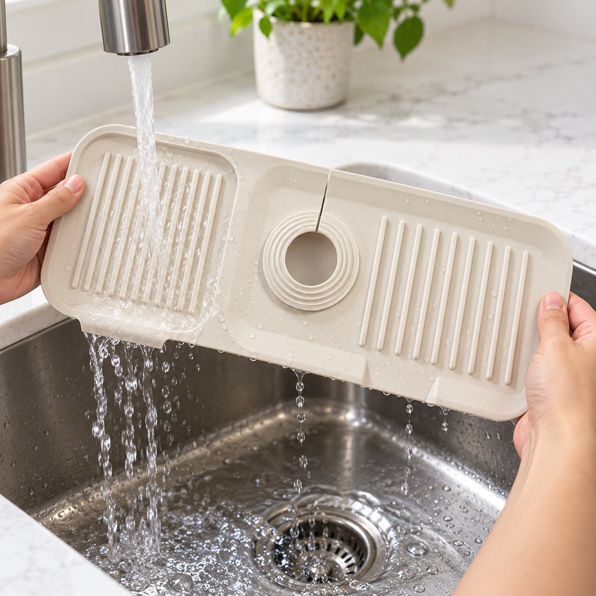 Illustration of a flexible faucet mat being rinsed over a basin