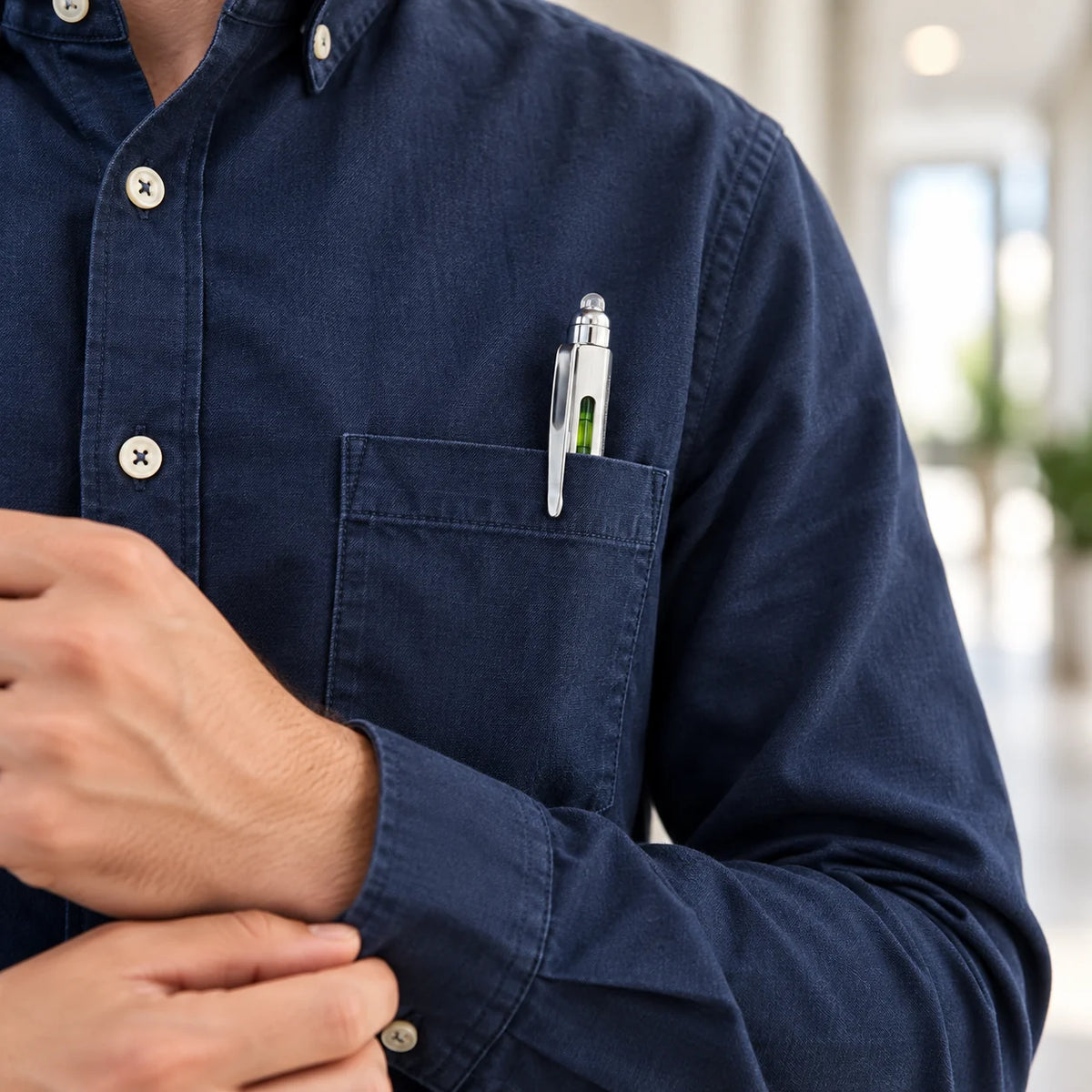 Compact metal multitool pen carried in an everyday pocket